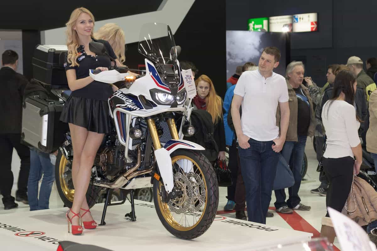 Beautiful hostesses present motorcycle Honda CRF1000L Africa Twi